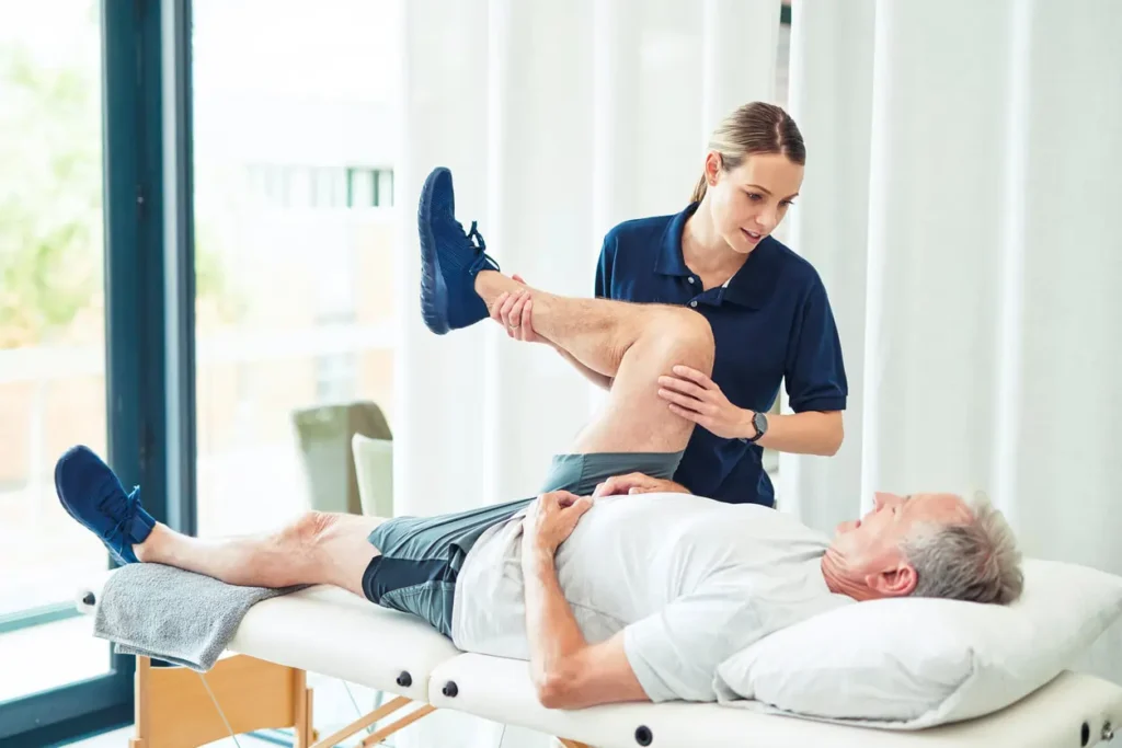 Revitalising Recovery: Effective Rehabilitation Strategies for Muscle Injuries 3 Physiotherapist assisting a patient with muscle recovery exercises Newbury